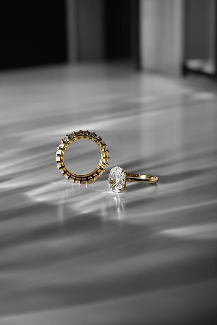 Close-up of luxury gold and diamond rings with a modern aesthetic, perfect for weddings and fashion.